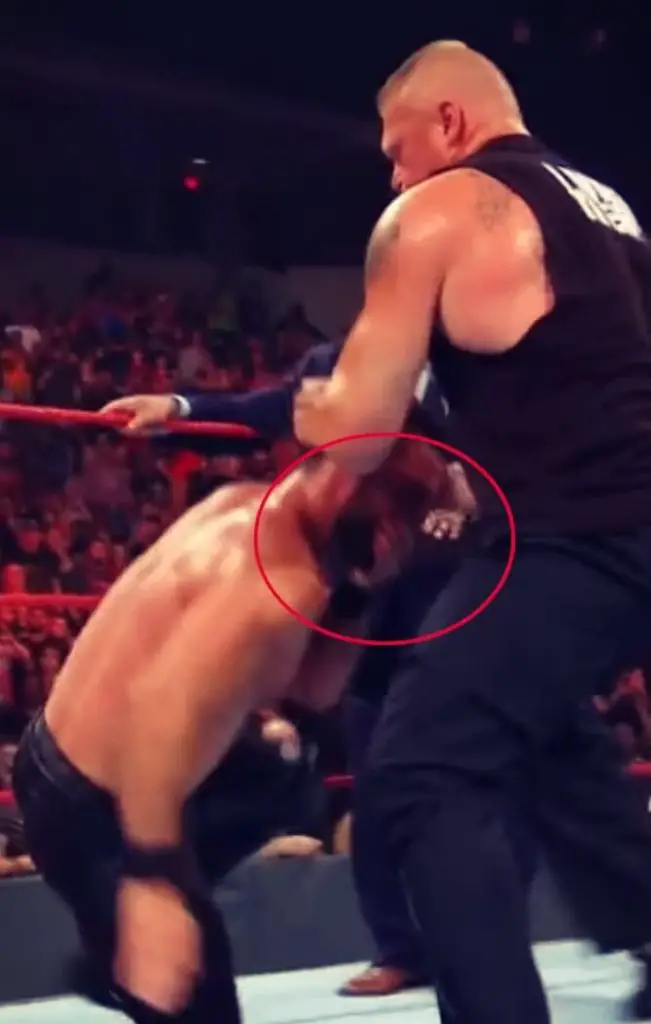Seth Rollins takes a fake blood capsule in WWE